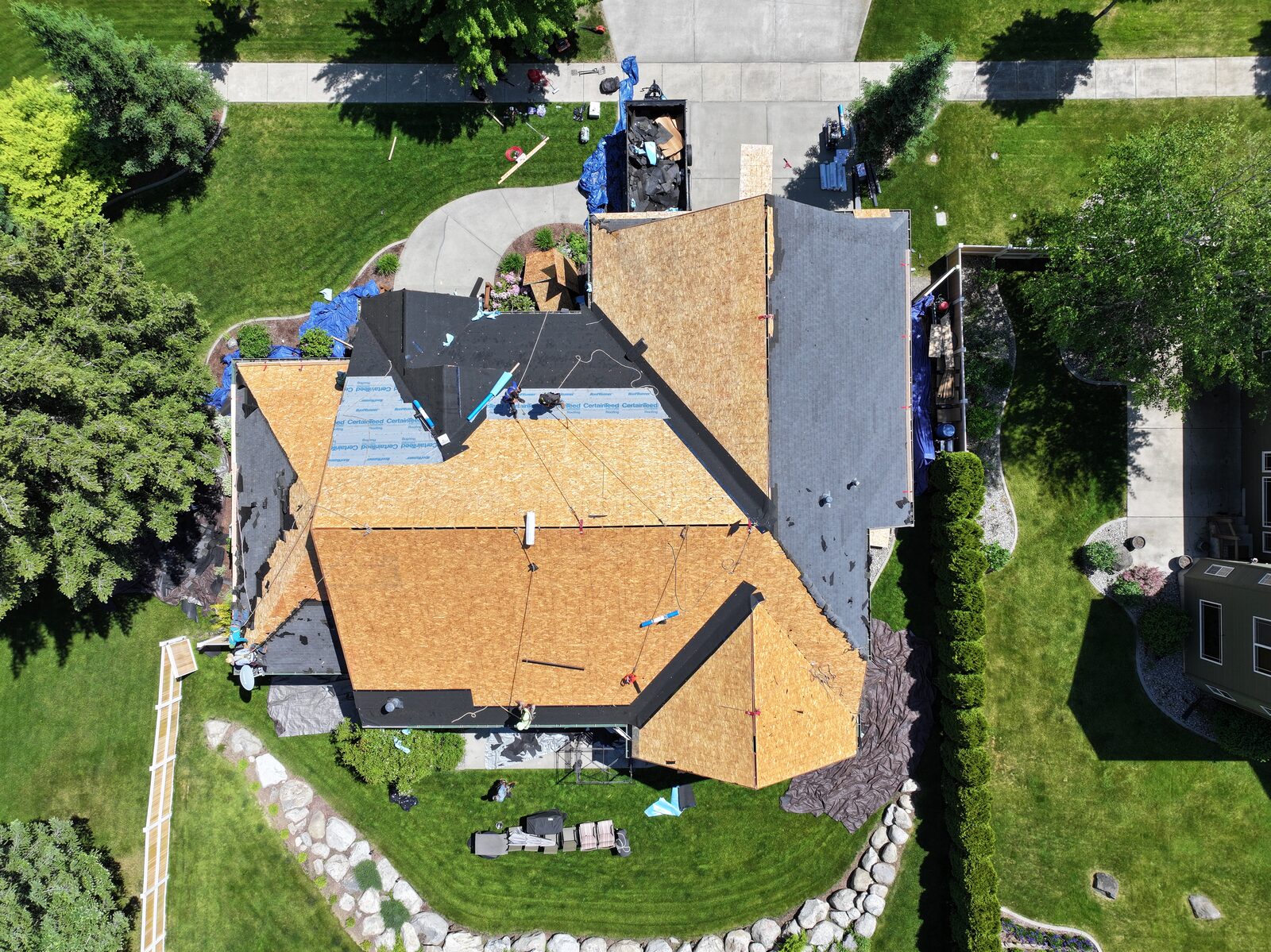 Roof replacement in progress on a North Idaho home, illustrating the repair versus replacement decision