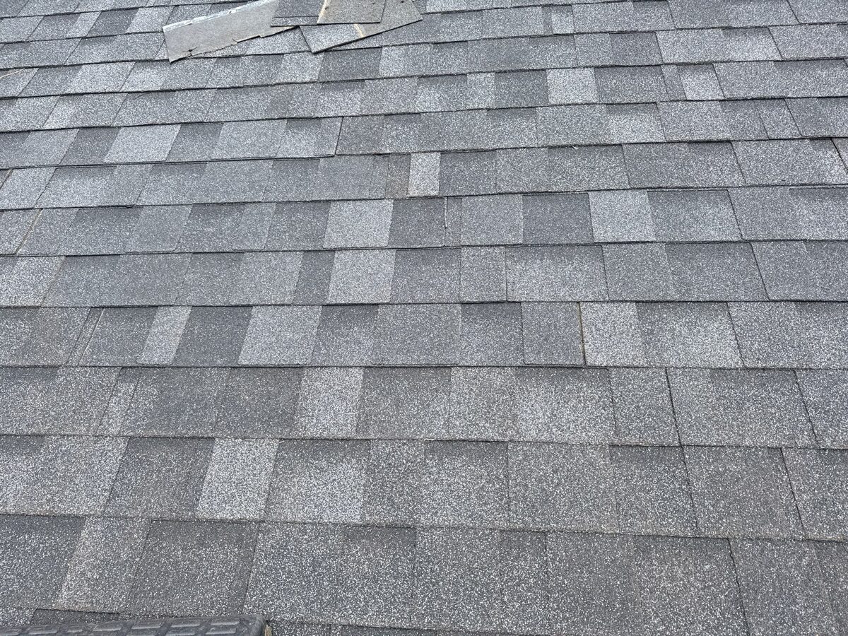 The same North Idaho roof after a targeted shingle repair with the install corrected