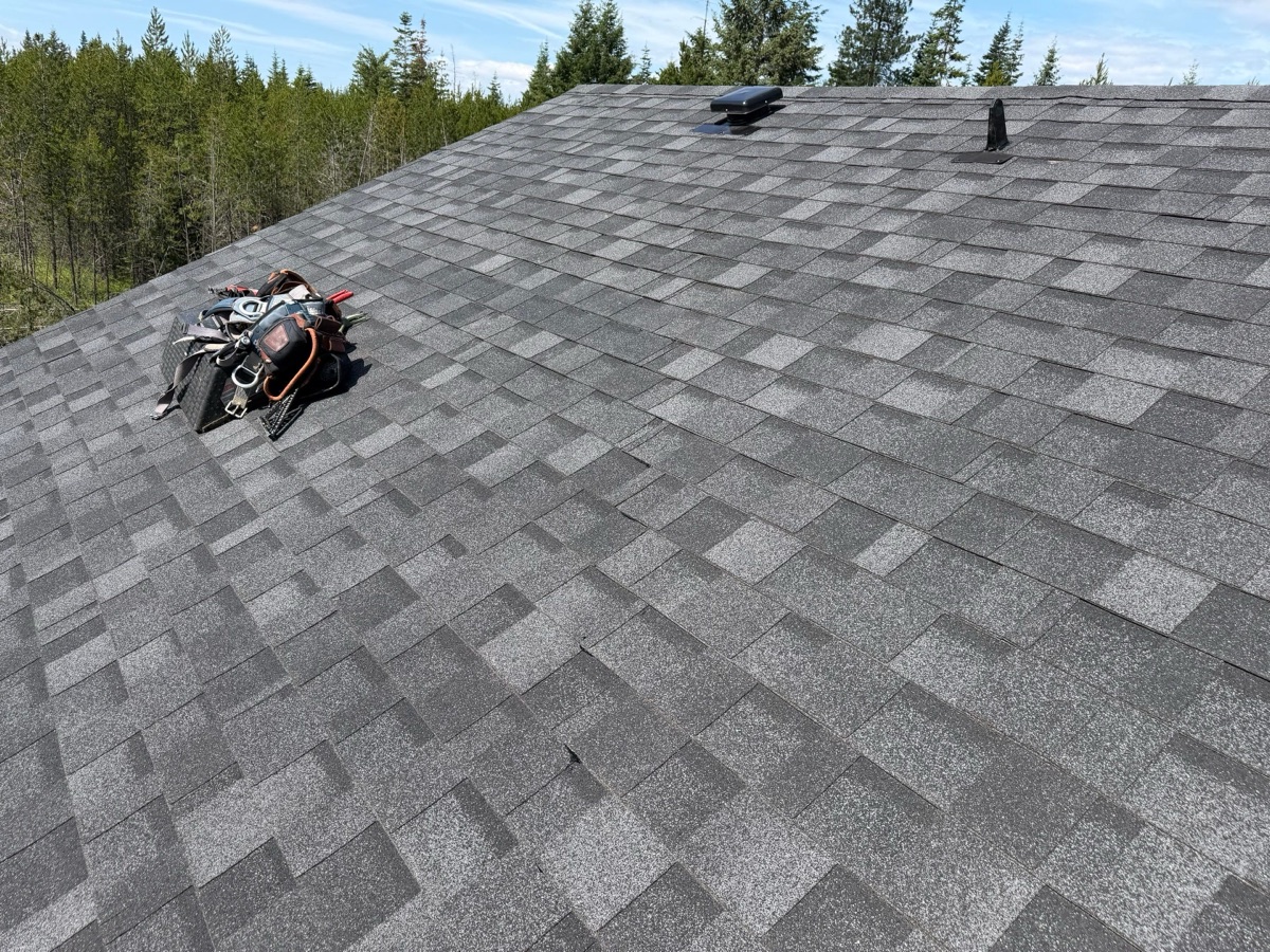 A newly installed asphalt shingle roof on a North Idaho home, seen from above