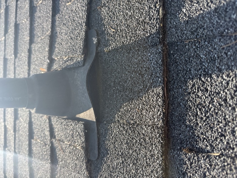 Builder-grade roof showing wear in Veradale