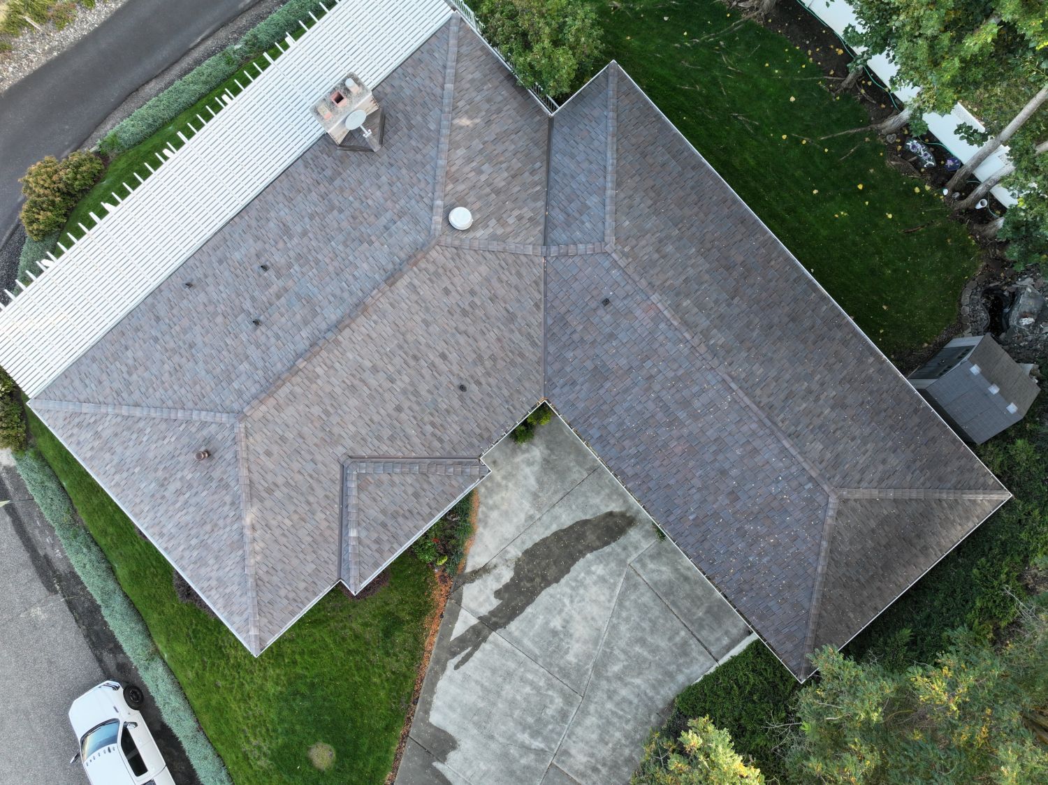 After: top-down aerial of the finished Brava roof showing every hip and valley