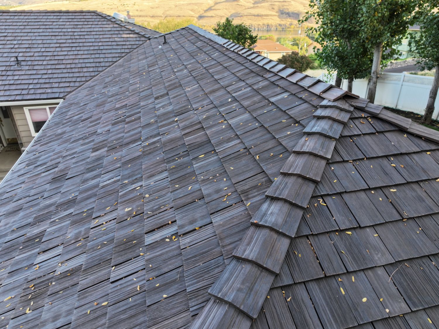 After: close-up of Brava hip and ridge caps and the cedar grain texture