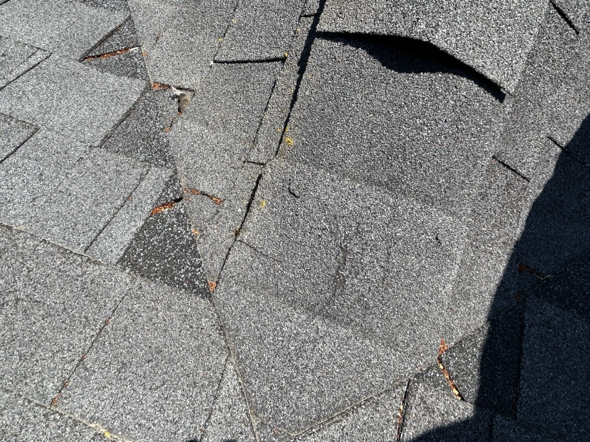 Before: Close-up of roof damage