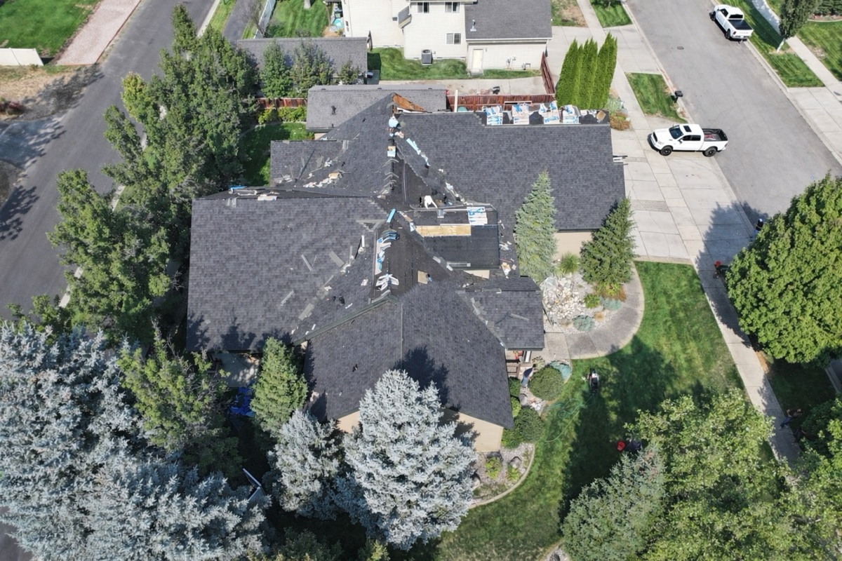 Drone view of crew working during roof replacement