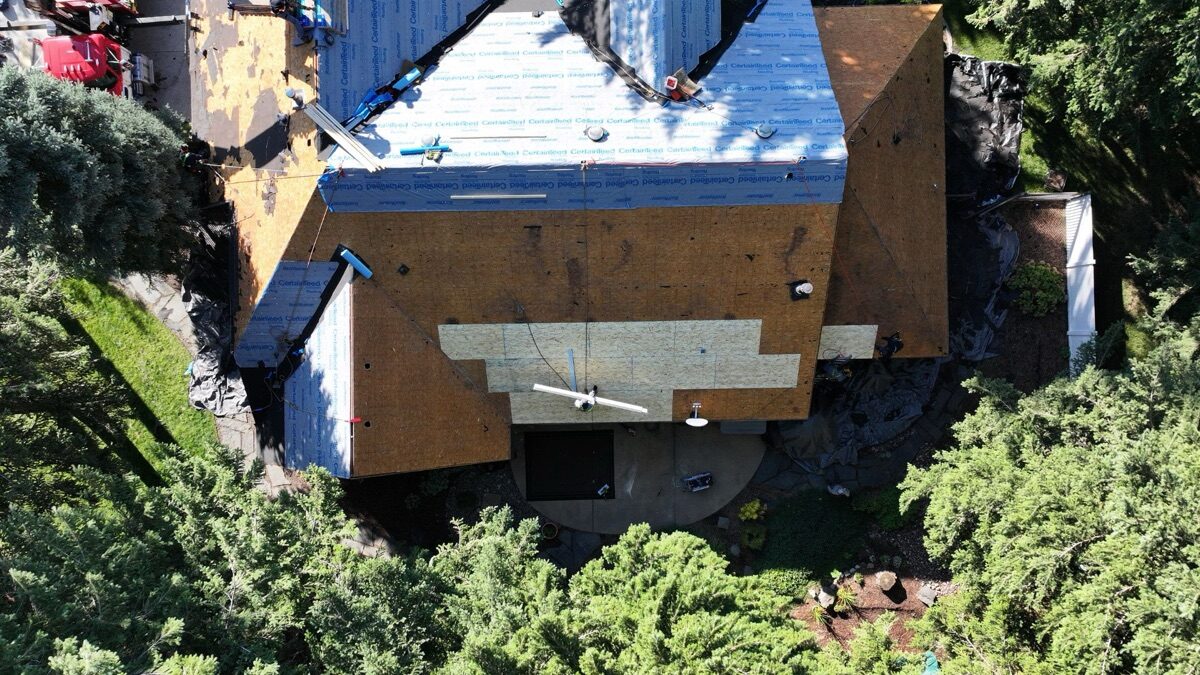 Top-down aerial showing new decking installed alongside synthetic underlayment