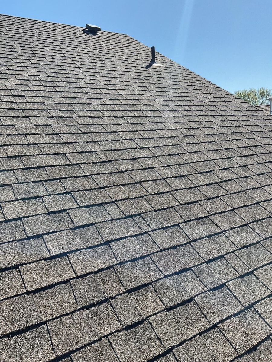 Before: Worn shingles on residential home