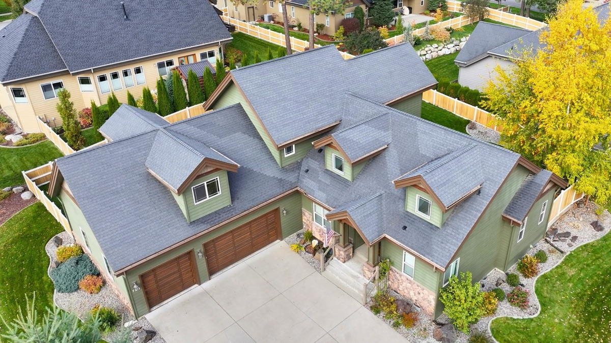 Before: Worn shingles on residential home