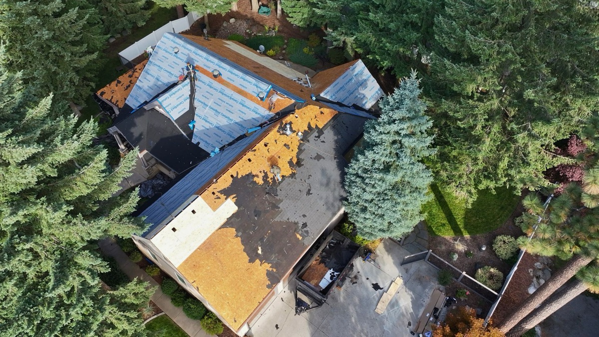 During: aerial view of tear-off and new underlayment in progress